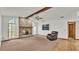 Living room featuring a brick fireplace and hardwood floors at 4616 Musket Dr, Lakeland, FL 33810