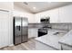 Modern kitchen with stainless steel appliances and granite countertops at 5108 Sylas Jax Ave, Winter Haven, FL 33884