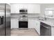 Modern kitchen featuring stainless steel appliances and granite countertops at 5108 Sylas Jax Ave, Winter Haven, FL 33884