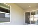 Covered patio with sliding glass doors and windows at 5108 Sylas Jax Ave, Winter Haven, FL 33884