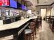 Large bar with granite countertop and TVs at 6064 Condor Dr, Lakeland, FL 33809