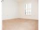 Spacious bedroom with neutral carpeting and large window at 6064 Condor Dr, Lakeland, FL 33809