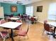 Community dining room with multiple tables and chairs at 6064 Condor Dr, Lakeland, FL 33809