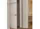 White door with panel design leading to a bathroom at 6064 Condor Dr, Lakeland, FL 33809