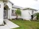 House exterior showcasing walkway and landscaping at 6064 Condor Dr, Lakeland, FL 33809