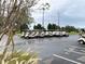 Row of golf carts parked in a lot at 6064 Condor Dr, Lakeland, FL 33809