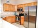 Kitchen boasts stainless steel appliances and ample cabinetry at 6064 Condor Dr, Lakeland, FL 33809