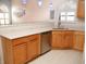 Modern kitchen with stainless steel appliances and light wood cabinets at 6064 Condor Dr, Lakeland, FL 33809