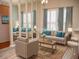 Bright living room with large windows and hardwood floors at 6064 Condor Dr, Lakeland, FL 33809
