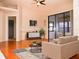 Spacious living room featuring hardwood floors and access to a screened lanai at 6064 Condor Dr, Lakeland, FL 33809