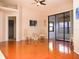 Living room with hardwood floors and access to a screened lanai at 6064 Condor Dr, Lakeland, FL 33809