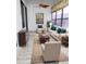 Relaxing screened lanai with tiled floors and ceiling fan at 6064 Condor Dr, Lakeland, FL 33809