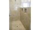 Large walk-in shower with neutral tile and built-in niches at 6064 Condor Dr, Lakeland, FL 33809