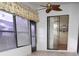 Bright sunroom with sliding glass doors and window blinds at 6064 Condor Dr, Lakeland, FL 33809