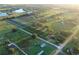 Aerial view of farm property at sunrise at 6155 Bethlehem Rd, Mulberry, FL 33860