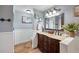 Bright bathroom with double vanity and updated fixtures at 6155 Bethlehem Rd, Mulberry, FL 33860