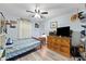 Cozy bedroom with a ceiling fan and dresser at 6155 Bethlehem Rd, Mulberry, FL 33860