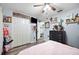 Spacious bedroom with ceiling fan, dresser and closet at 6155 Bethlehem Rd, Mulberry, FL 33860