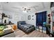 Well-lit bedroom with a ceiling fan and a dresser at 6155 Bethlehem Rd, Mulberry, FL 33860