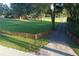 Long driveway with wooden fence leading to the property at 6155 Bethlehem Rd, Mulberry, FL 33860