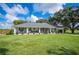Charming ranch home with a large front porch and expansive lawn at 6155 Bethlehem Rd, Mulberry, FL 33860