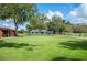 Home with a large front yard and long driveway at 6155 Bethlehem Rd, Mulberry, FL 33860