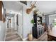 Bright hallway with wood-look floors and access to bedrooms at 6155 Bethlehem Rd, Mulberry, FL 33860