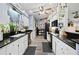 Modern kitchen with black countertops and white cabinets at 6155 Bethlehem Rd, Mulberry, FL 33860