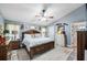 Spacious main bedroom with a ceiling fan and large bed at 6155 Bethlehem Rd, Mulberry, FL 33860