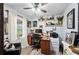 Home office with built-in shelving and a comfortable workspace at 6155 Bethlehem Rd, Mulberry, FL 33860