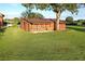 Wooden outbuilding with covered patio area at 6155 Bethlehem Rd, Mulberry, FL 33860