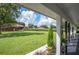Covered porch overlooking the backyard and farmland at 6155 Bethlehem Rd, Mulberry, FL 33860