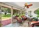 Relaxing screened porch with patio furniture and view at 6155 Bethlehem Rd, Mulberry, FL 33860