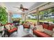 Cozy screened porch features wicker furniture and a view at 6155 Bethlehem Rd, Mulberry, FL 33860