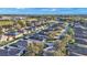 Aerial view of a community with houses, landscaping, and a pond at 6799 Glenbrook Dr, Lakeland, FL 33811