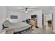 Bright bedroom with ceiling fan, large bed, and en-suite bathroom at 6799 Glenbrook Dr, Lakeland, FL 33811