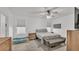 Bedroom with a queen bed, nightstand and an adjacent closet at 6799 Glenbrook Dr, Lakeland, FL 33811