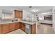 Kitchen with wood cabinets, granite countertops, and stainless steel appliances at 6799 Glenbrook Dr, Lakeland, FL 33811