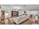 Spacious living room with hardwood floors, sectional sofa and entertainment center at 6799 Glenbrook Dr, Lakeland, FL 33811