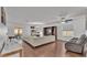 Living room features hardwood floors, sectional sofa, and built-in shelving at 6799 Glenbrook Dr, Lakeland, FL 33811