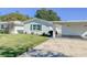 Front view of a single story home with carport at 718 Barber Cir # 718, Lakeland, FL 33803
