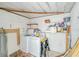 Laundry room with washer, dryer, and storage shelves at 718 Barber Cir # 718, Lakeland, FL 33803