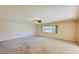 Spacious living room with ample natural light and ceiling fan at 718 Barber Cir # 718, Lakeland, FL 33803