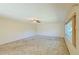 Bright and airy living room with large window and ceiling fan at 718 Barber Cir # 718, Lakeland, FL 33803