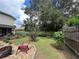 Private backyard with firepit and lush landscaping at 737 Butternut Pl, Lakeland, FL 33813