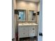 Double vanity bathroom with modern white cabinets at 737 Butternut Pl, Lakeland, FL 33813