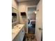 Bathroom with double vanity and view into bedroom at 737 Butternut Pl, Lakeland, FL 33813