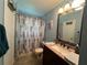 Bathroom with granite vanity and shower/tub combo at 737 Butternut Pl, Lakeland, FL 33813