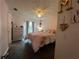 Bedroom with pink bedding and a ceiling fan at 737 Butternut Pl, Lakeland, FL 33813