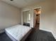 Spacious bedroom with mirrored closet doors and en-suite bathroom at 737 Butternut Pl, Lakeland, FL 33813